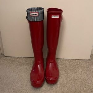 Red tall hunter boots with with hunter socks.